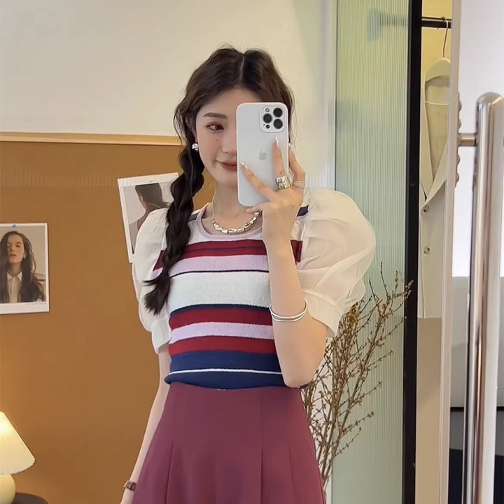 Women's short sleeve top with sophisticated puff sleeves and colorful striped pattern