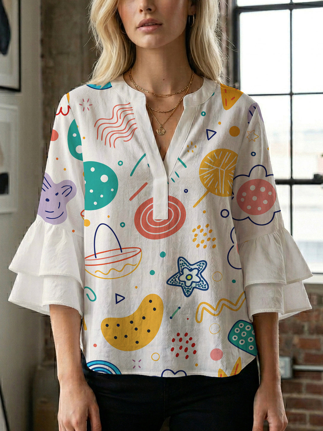 Women’s blouse with voluminous ruffled sleeves and floral pattern Lisslune