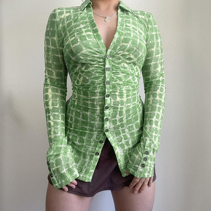 Ladies fitted blouse with sophisticated ruffle design and elegant button closure