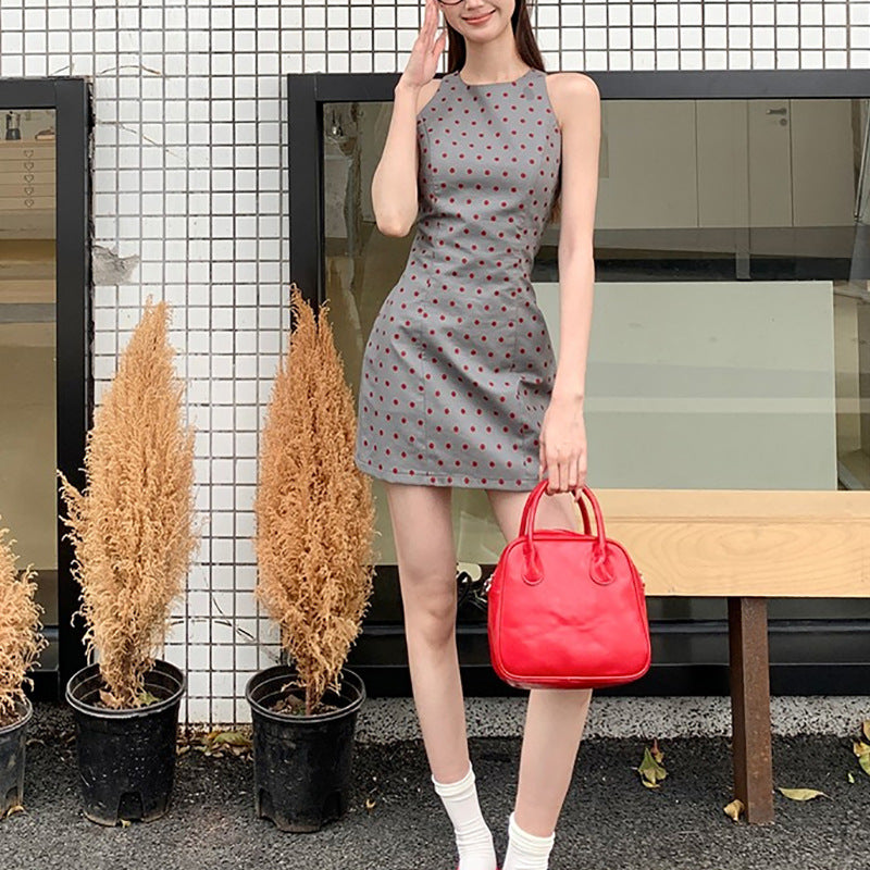 Women's sheath dress with polka dot pattern and figure-hugging cut