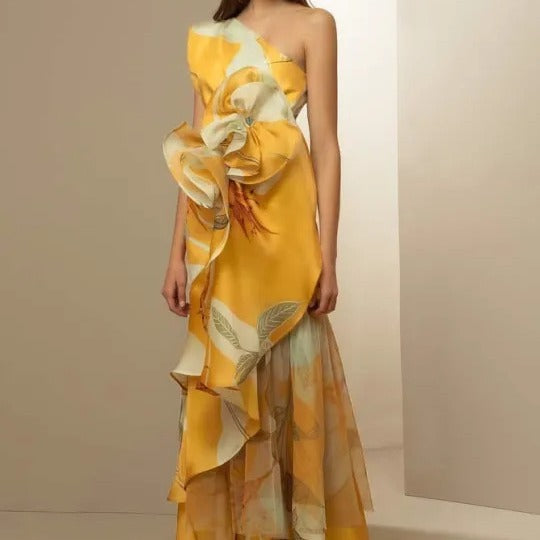 Women's elegant asymmetrical evening dress with flowing skirt and eye-catching ruffle details
