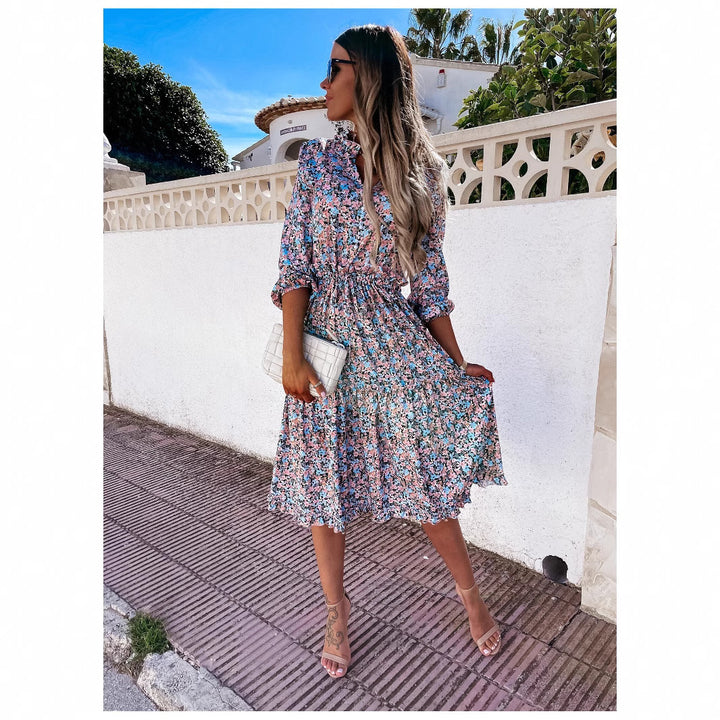 Women's floral dress with playful ruffle details and knee-length cut