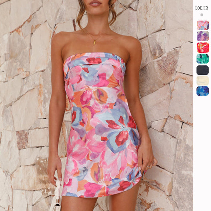 Ladies flirty mini dress in bandeau style with floral accents and swinging hem