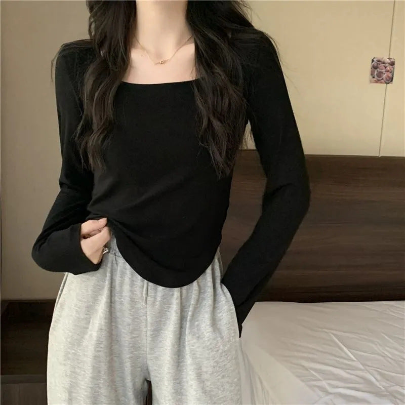 Women's long sleeve top with elegant square neckline and modern cut