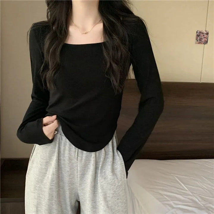 Women's long sleeve top with elegant square neckline and modern cut