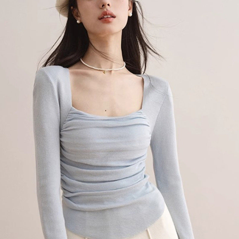 Women's fitted top with elegant gathering effect