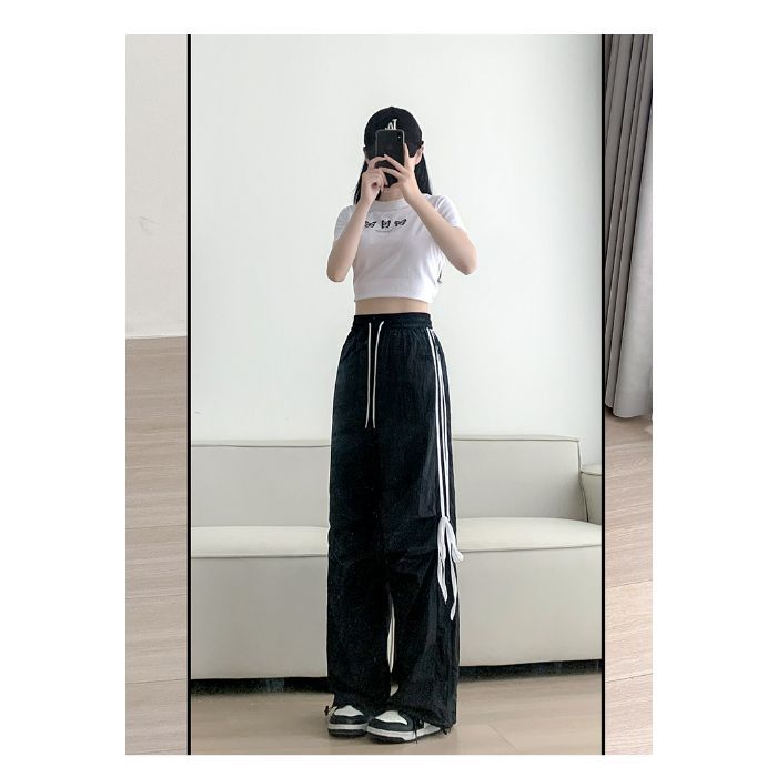 Women’s casual sports pants with side stripes and comfortable drawstring waistband