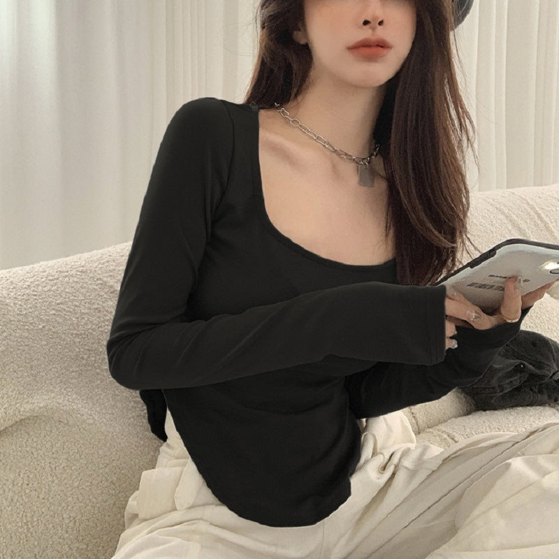 Women's long-sleeved top with elegant neckline and asymmetric design