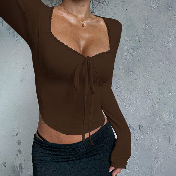 Women's long-sleeved crop top with sophisticated tie and elegant neckline