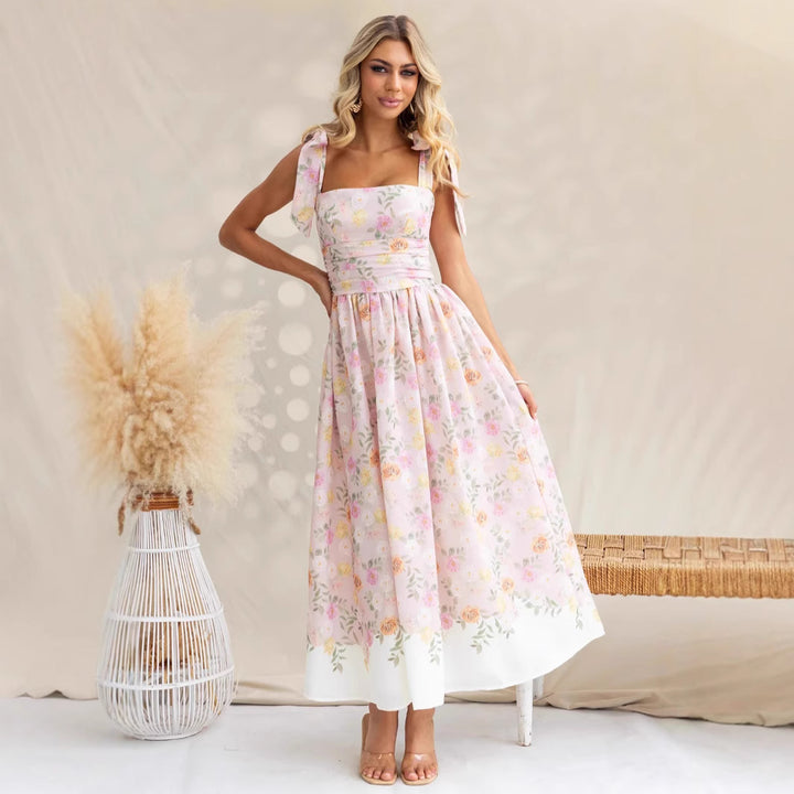 Women's maxi dress with playful straps and floral print