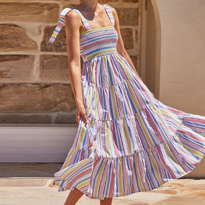 Women's maxi dress with flattering smocked top and playful straps