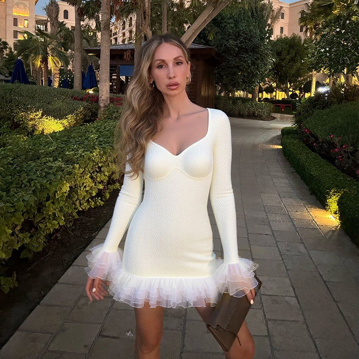 Women's mini dress with voluminous ruffle details and shaping top Lune London