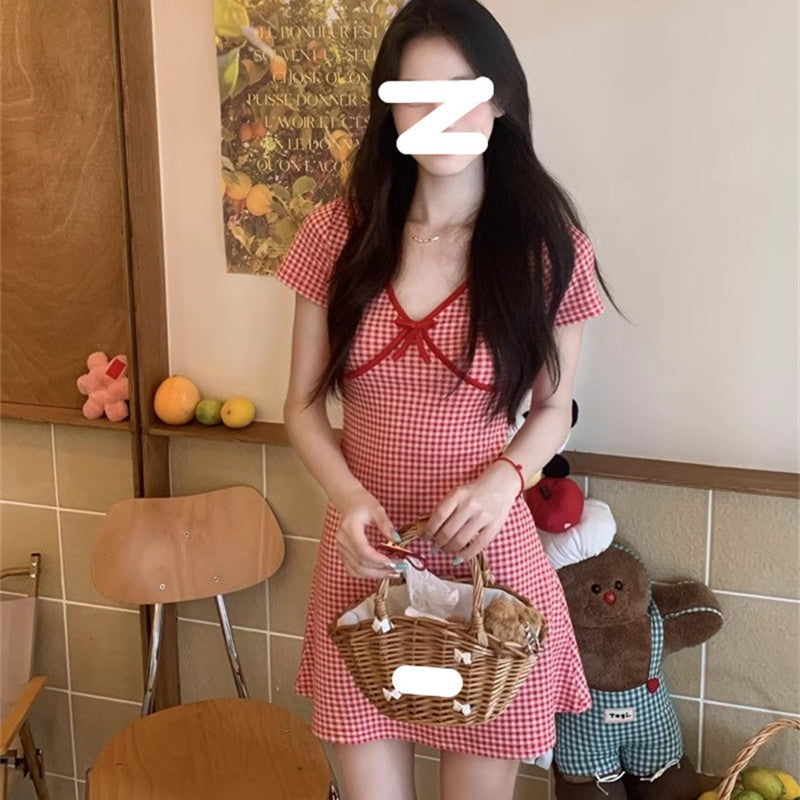 Ladies plaid mini dress with ruffle details and deep V-neck