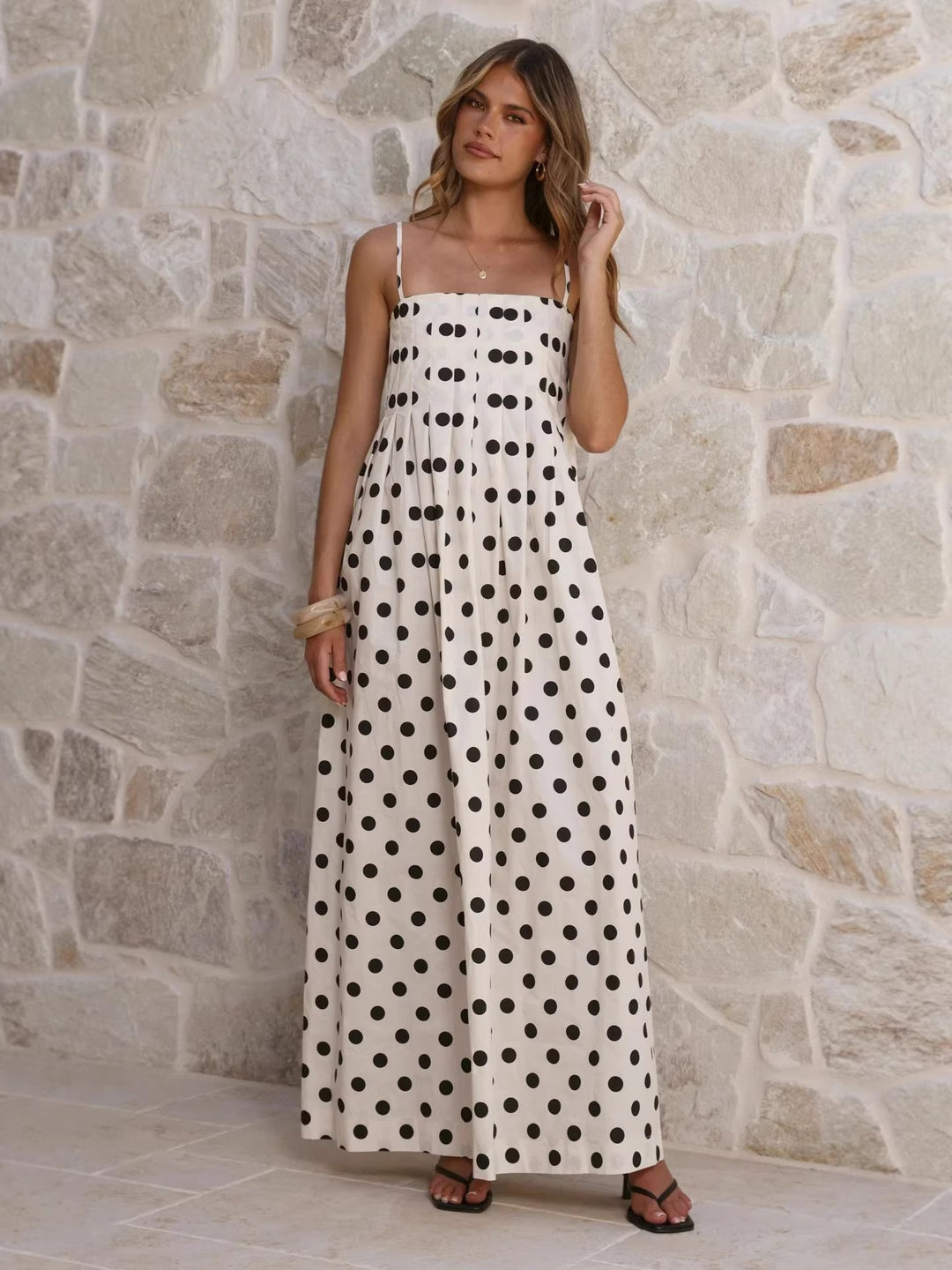 Women’s maxi dress with playful polka dot pattern and off-the-shoulder straps