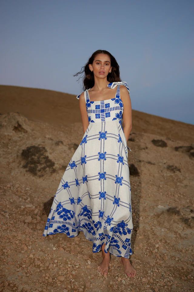 Women's maxi dress with playful check pattern and innovative strap details