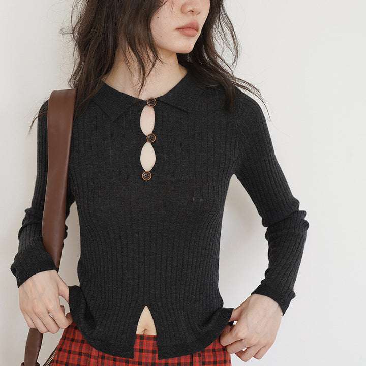 Women’s fine ribbed top with decorative button placket and side slit