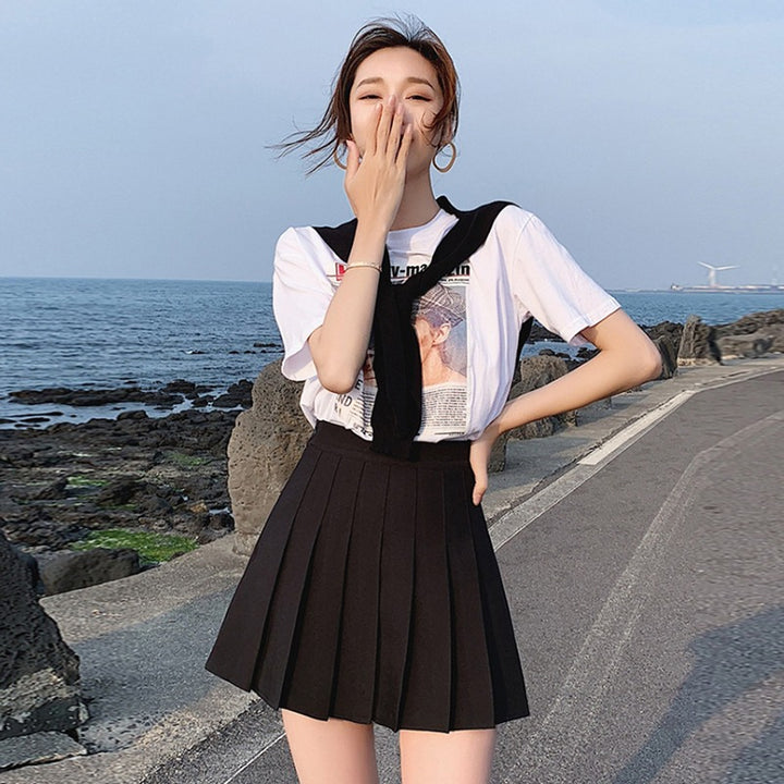 Women's short sleeve top with innovative cut and asymmetric details