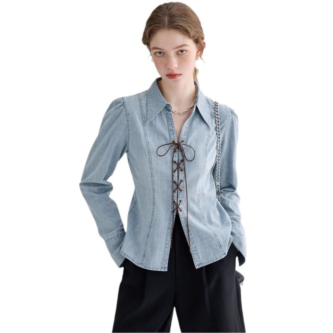 Ladies' jeans blouse with playful lacing details and elegant cut
