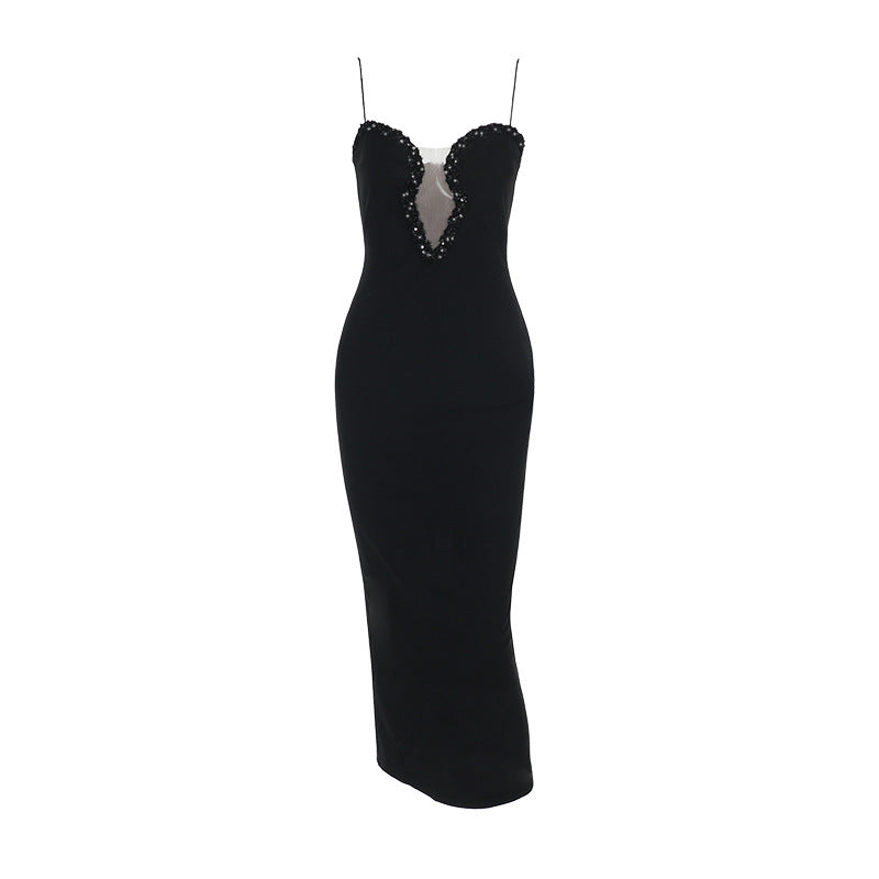 Women's evening dress with deep V-neckline and glamorous rhinestone details Lune London