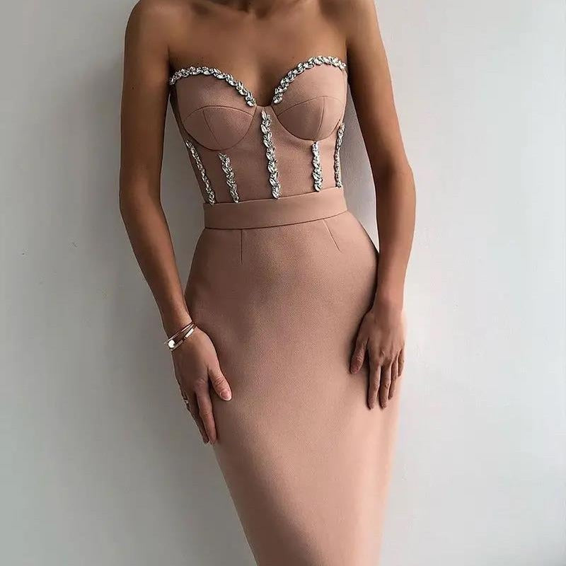 Women's figure-hugging evening dress with elegant bustier look and shimmering appliqués