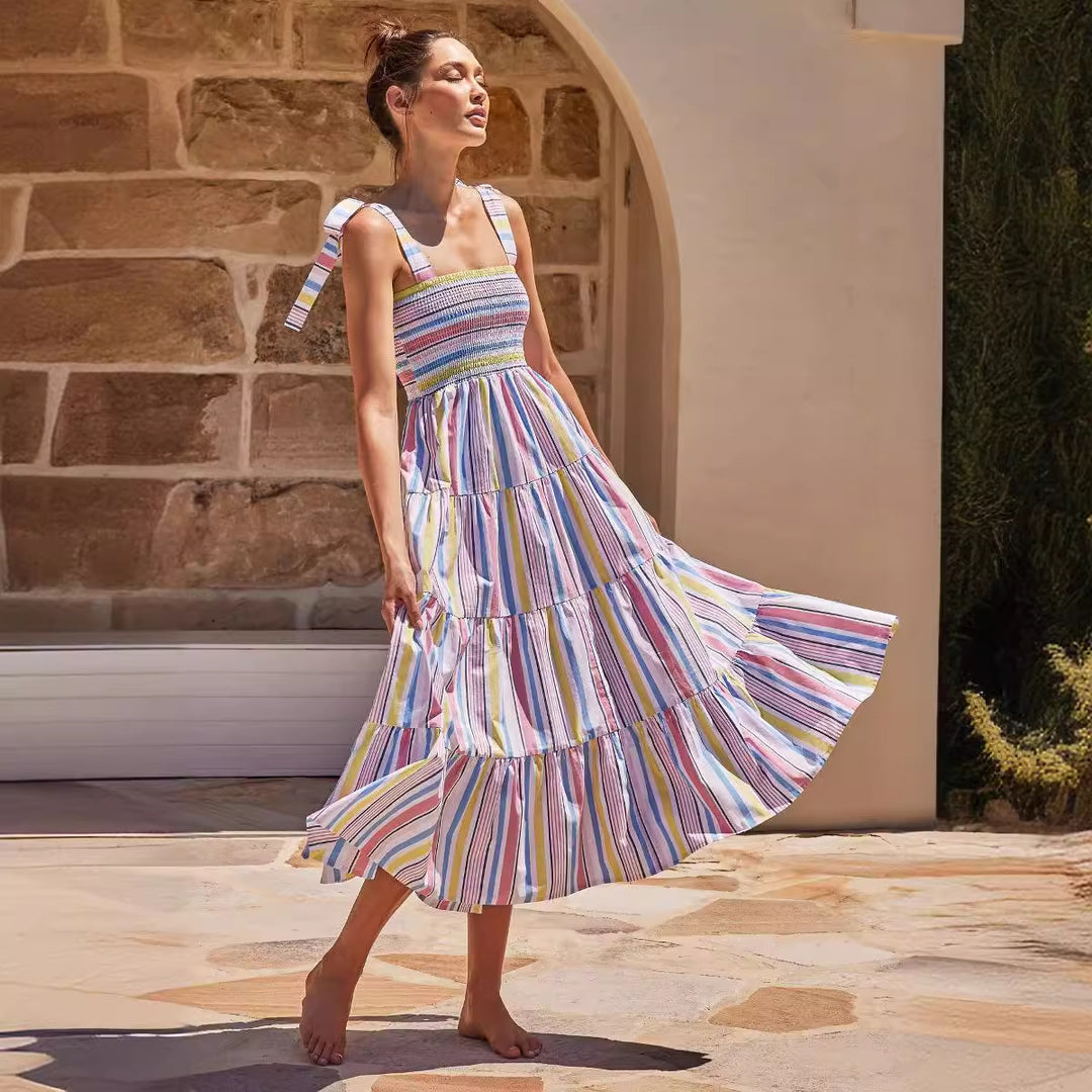 Women's maxi dress with flattering smocked top and playful straps