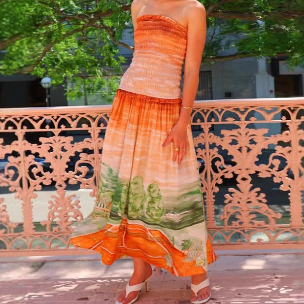 Women's maxi wrap dress with elastic top and flowing skirt