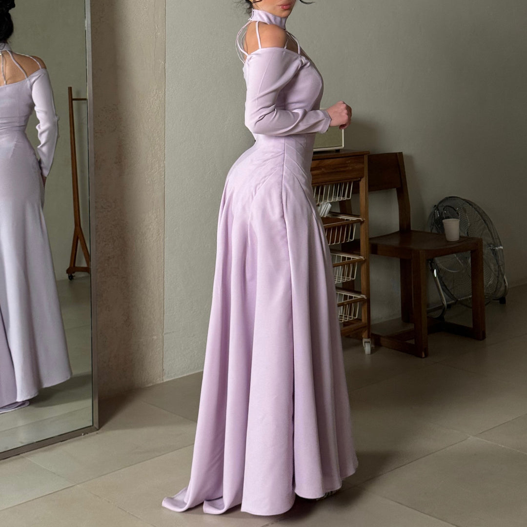 Ladies elegant evening dress with strategic cut-outs and flowing skirt