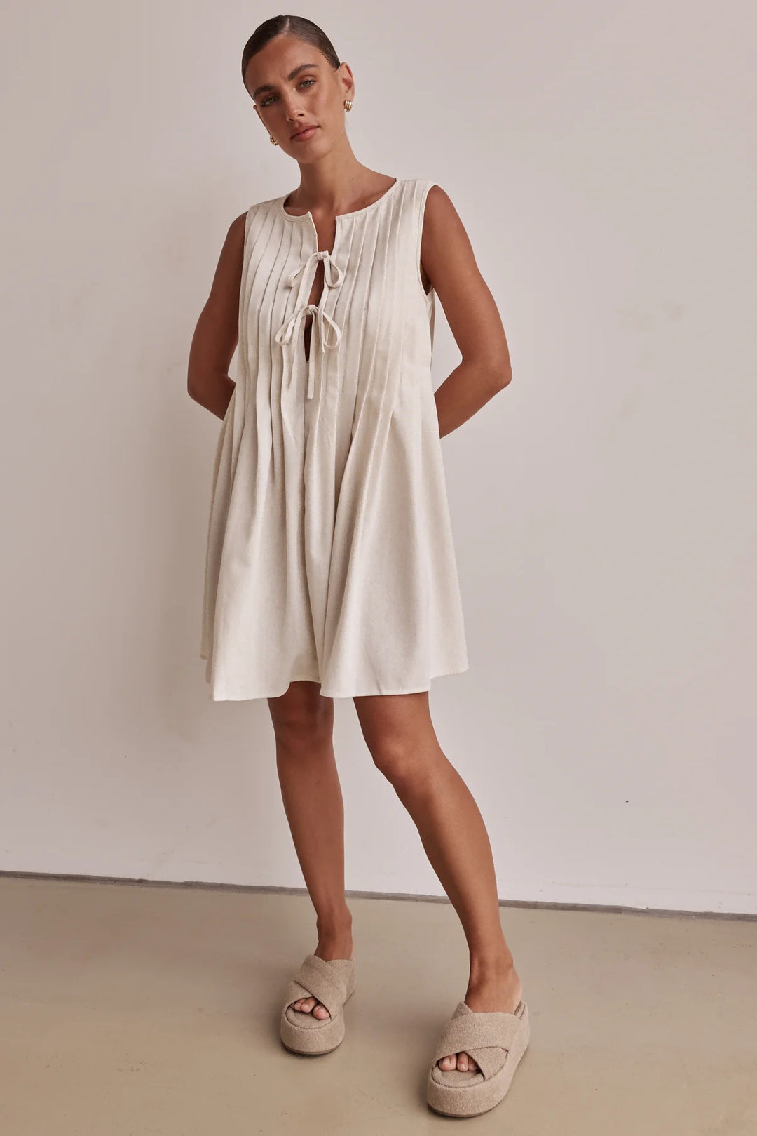 Ladies A-line dress with playful knot and refined pleats Lune London