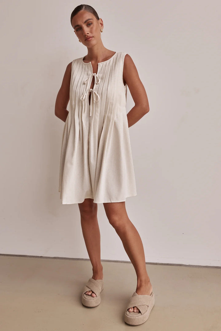 Ladies A-line dress with playful knot and refined pleats Lune London