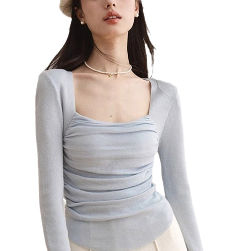 Women's fitted top with elegant gathering effect