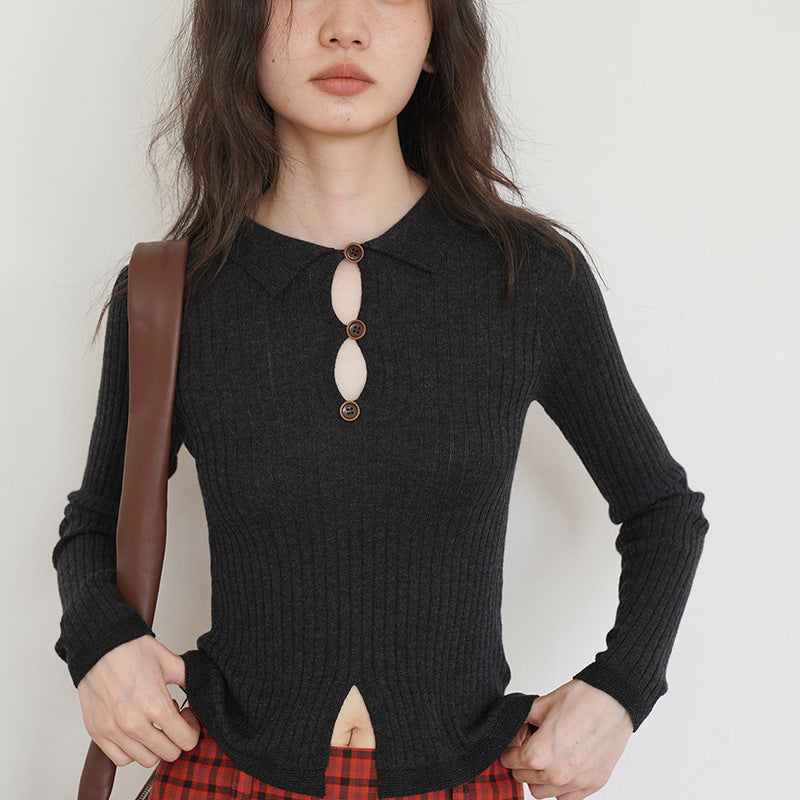 Women’s fine ribbed top with decorative button placket and side slit