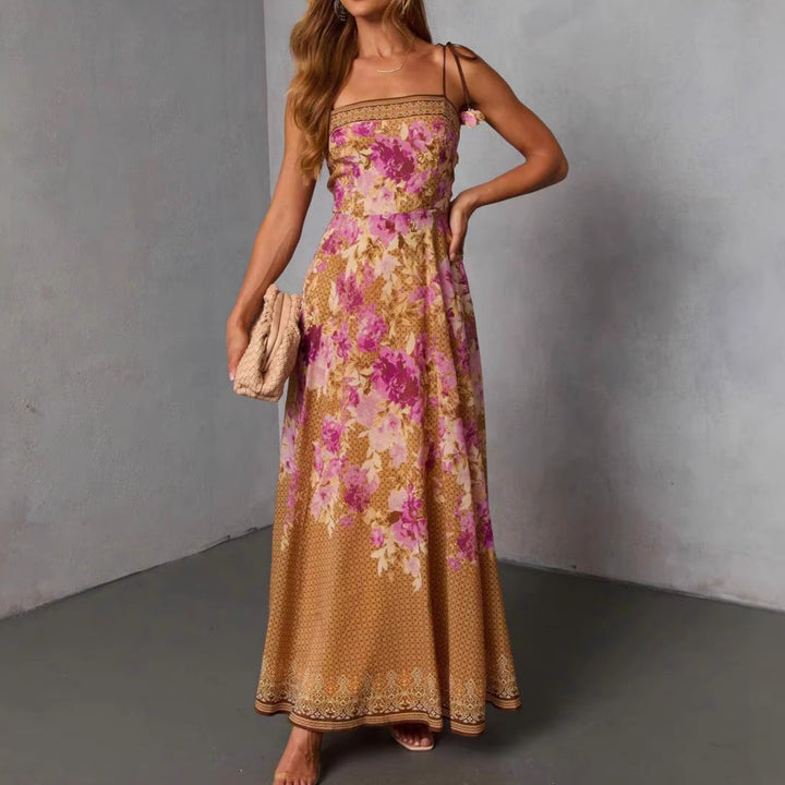 Women's maxi dress in romantic Bohemian style with floral accents and adjustable straps