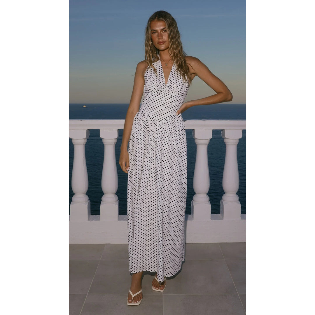 Women’s maxi dress with deep V-neckline and playful polka dot pattern