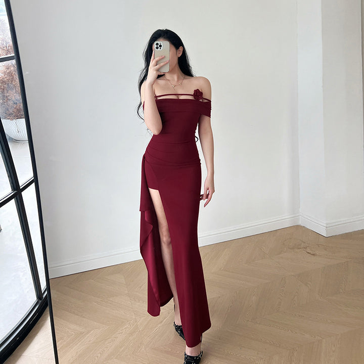Women's elegant off-shoulder maxi dress with sophisticated cut and floral accents
