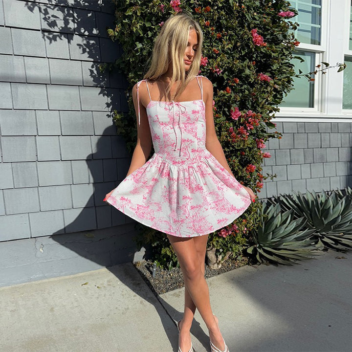 Women's playful midi dress with spaghetti straps and floral motifs Lune London