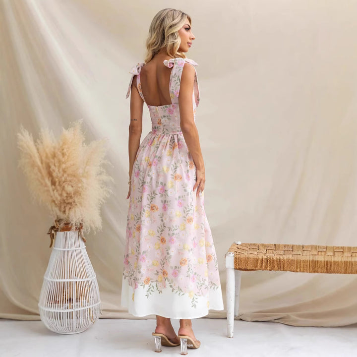 Women's maxi dress with playful straps and floral print