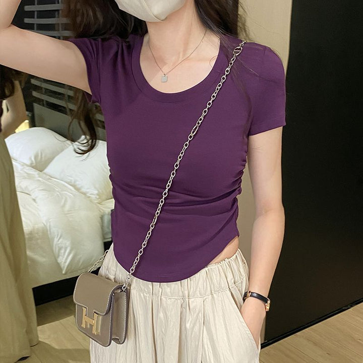 Women's fitted top with elegant round neck and delicate gathering effects