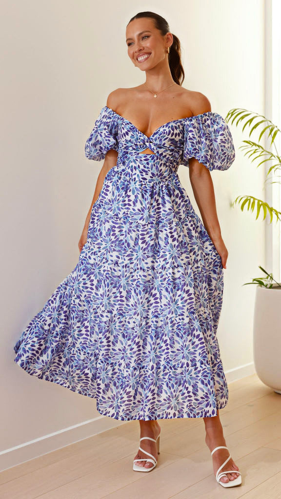 Women's maxi dress with voluminous puff sleeves and floral pattern