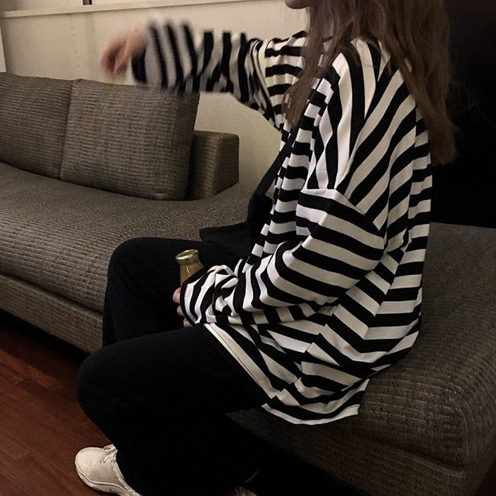 Women's striped long-sleeve shirt with a loose fit and modern details
