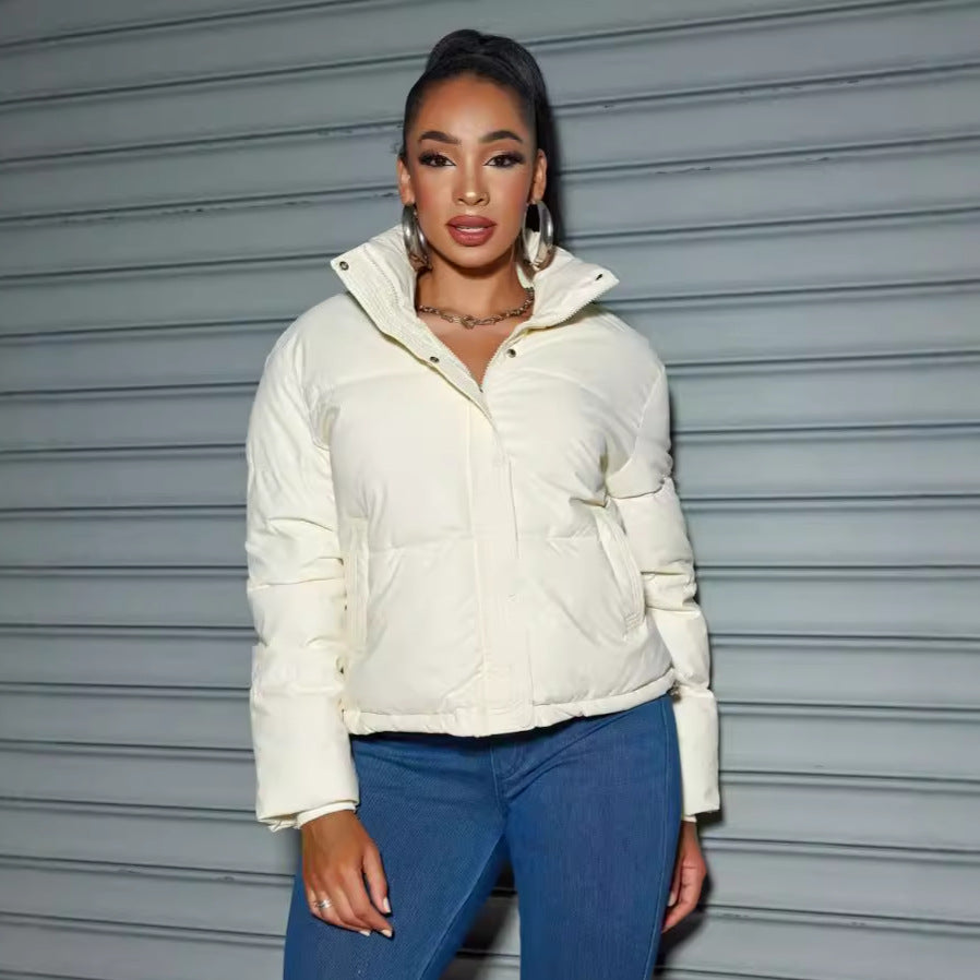 Women's quilted jacket with high collar and fitted cut