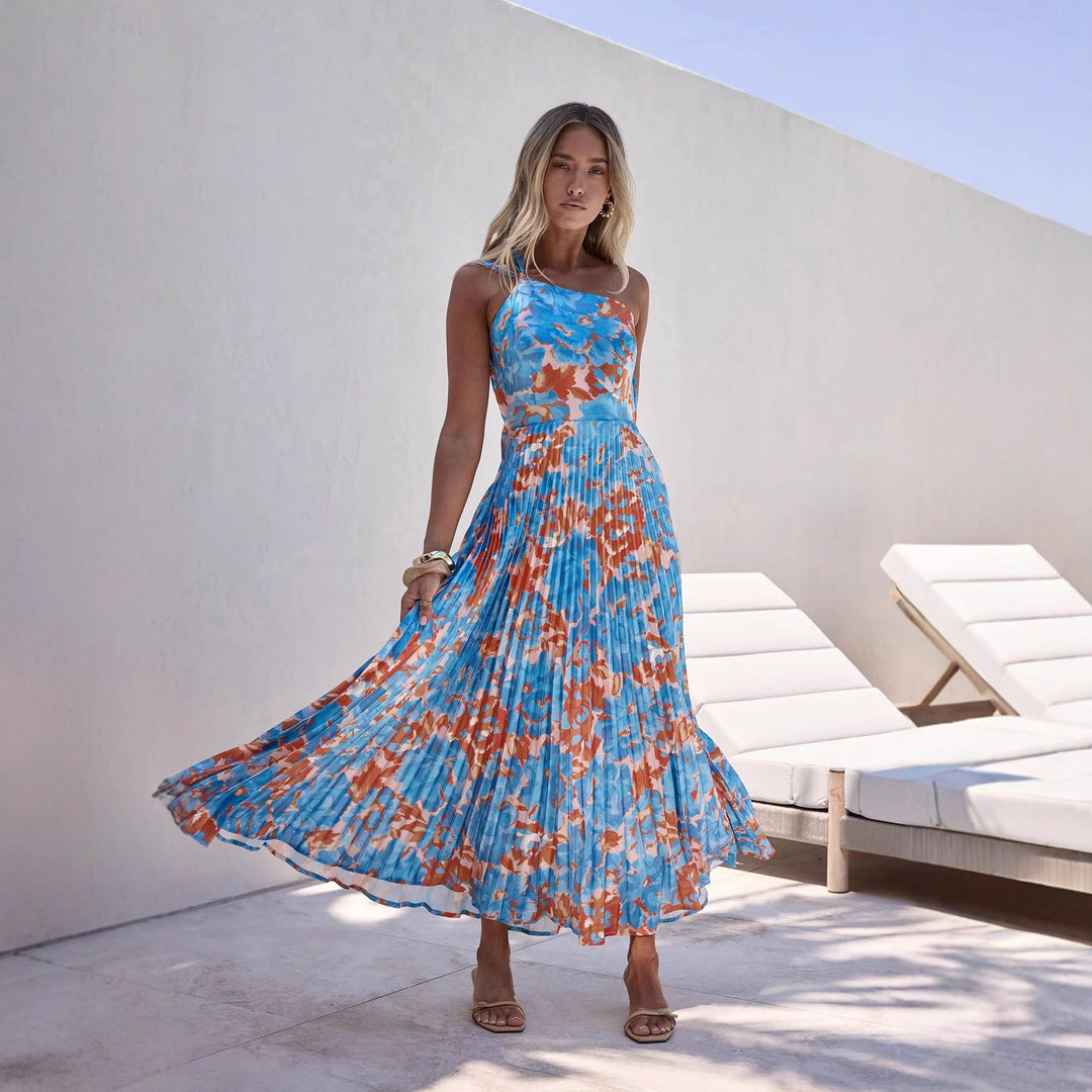 Ladies maxi dress with swinging pleated skirt and feminine floral design