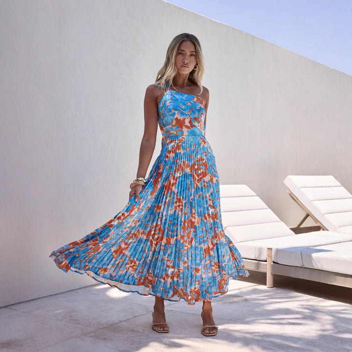 Ladies maxi dress with swinging pleated skirt and feminine floral design