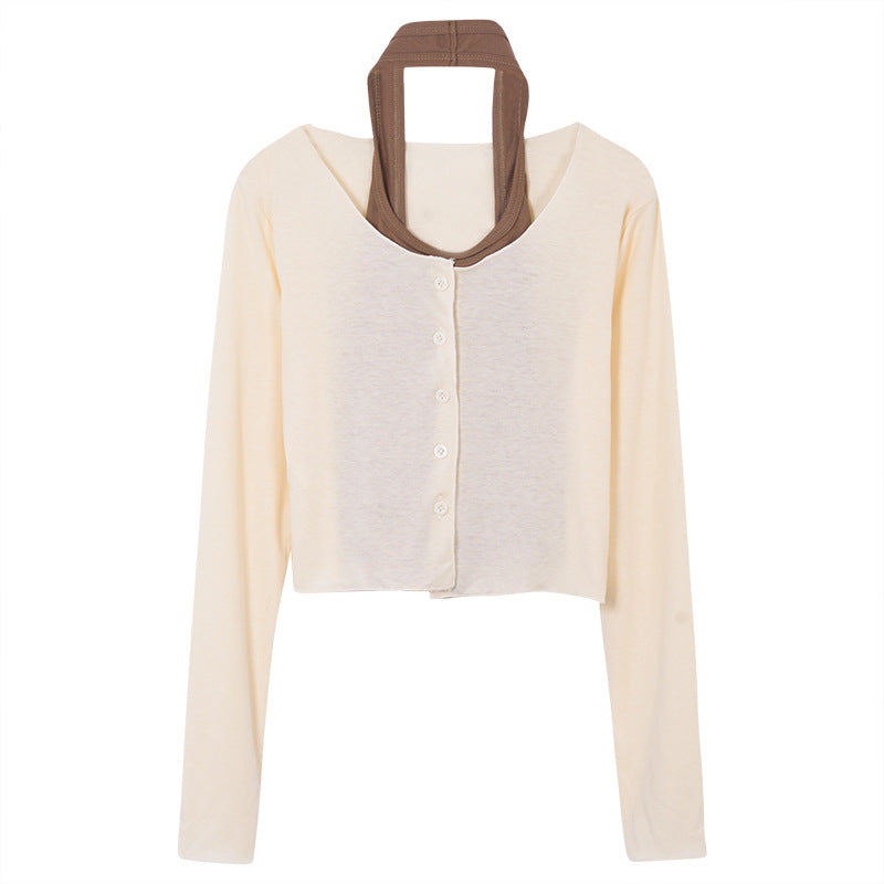 Women's long-sleeved crop top with button closure and elegant design