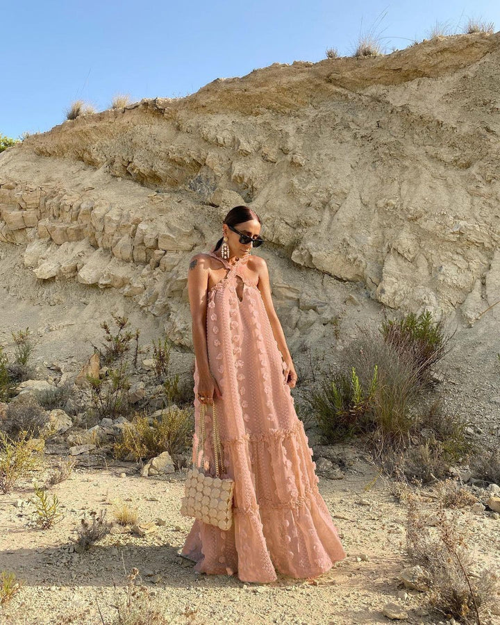 Women's maxi dress with playful ruffle details and floral pattern