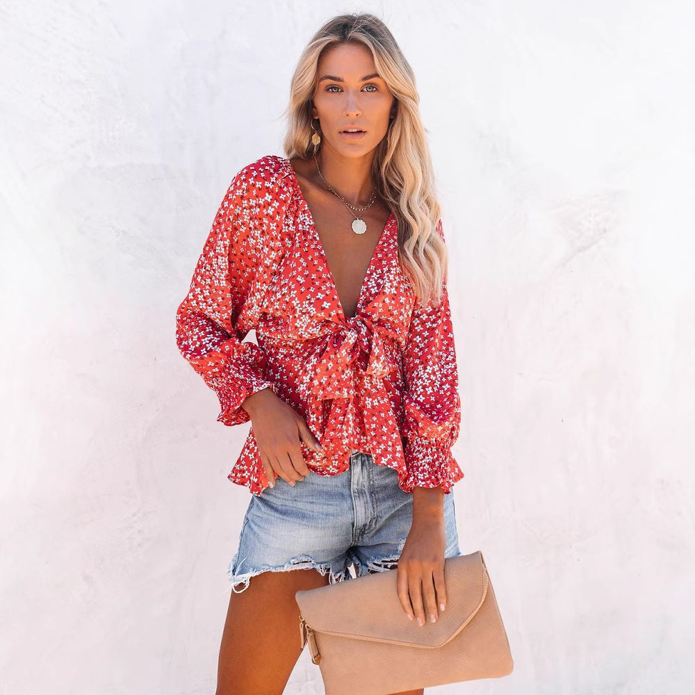 Ladies blouse top with playful floral pattern and elegant knot detail Lune London