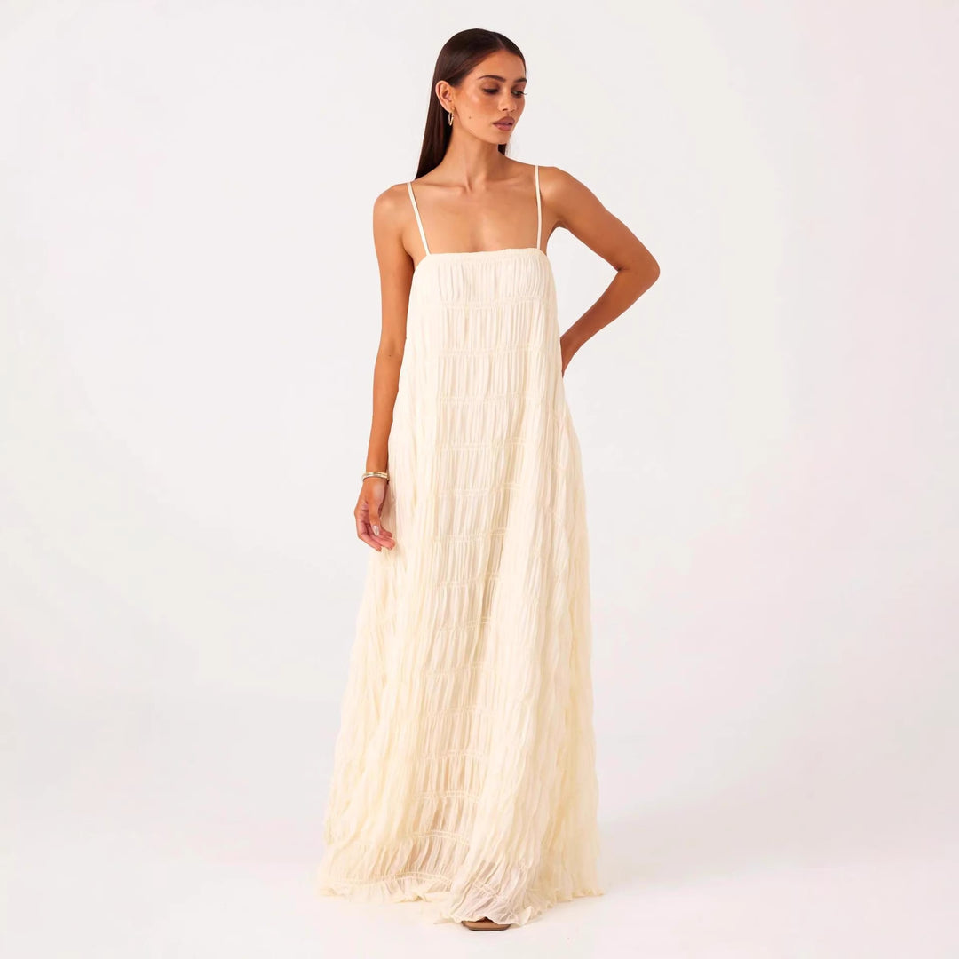 Women's maxi dress with romantic pleated structure and delicate spaghetti straps