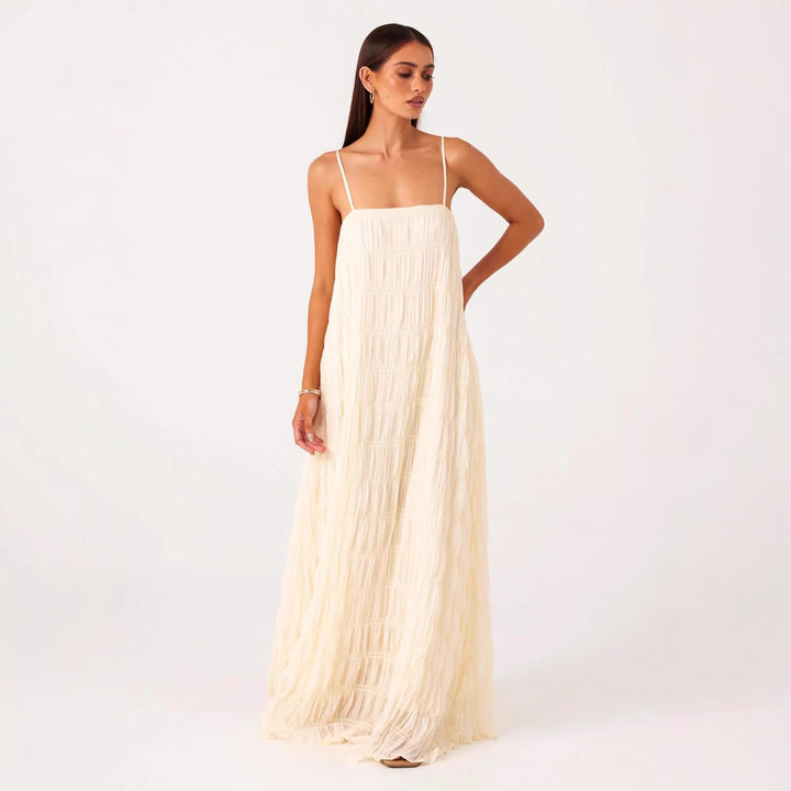 Women's maxi dress with romantic pleated structure and delicate spaghetti straps