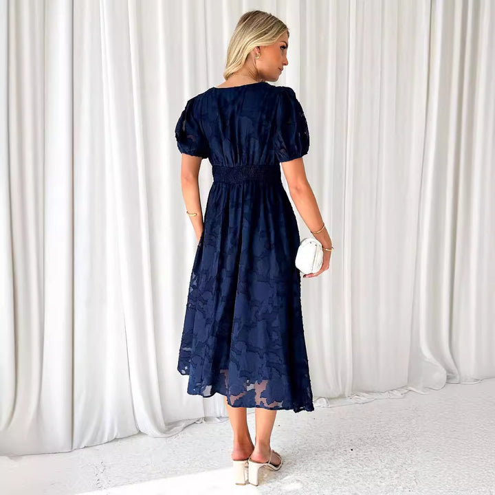 Women's maxi dress with floral accents and voluminous puff sleeves
