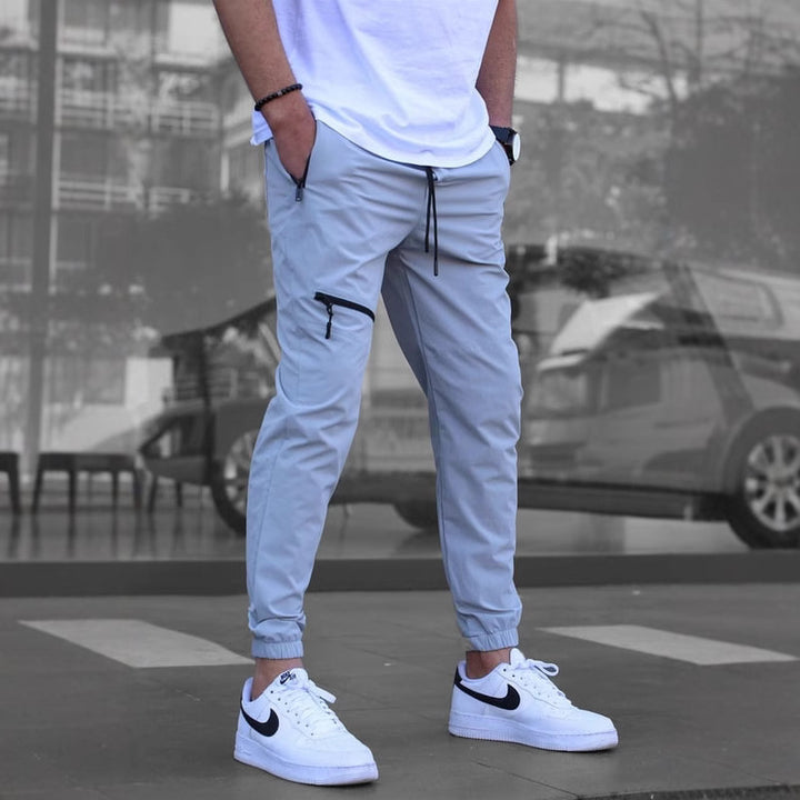 Men's sporty suit pants with elastic waistband and side zip pockets Lisslune