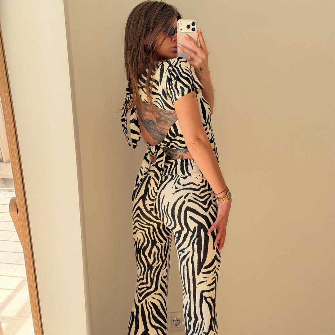 Women's set made of short-sleeved top and flared pants with zebra pattern